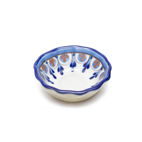 Ceramic bowl with blue and orange pattern on a white background