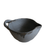 Black ceramic bowl with handle on a white background