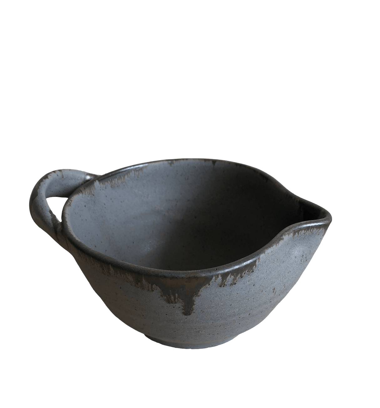 Black ceramic bowl with handle on a white background