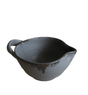 Black ceramic bowl with handle on a white background
