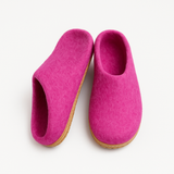 Pair of pink slippers on a white background