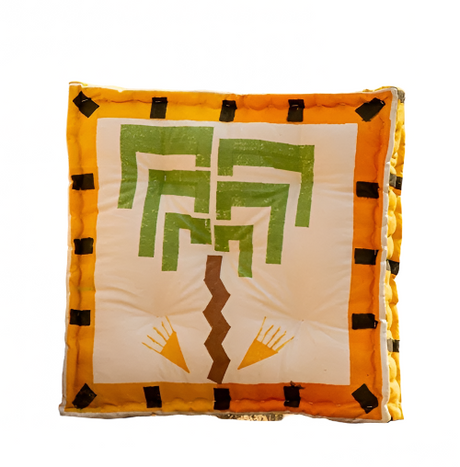 Decorative pillow with a geometric pattern on stone steps