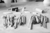 Set of paintbrushes and tools on a table