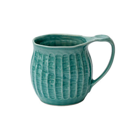 Teal textured mug on a white background