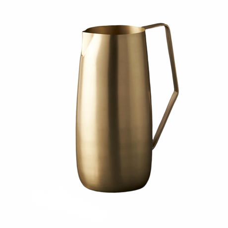 Gold pitcher with handle on a white background