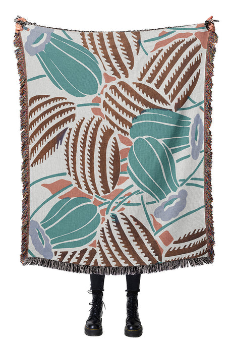 Botanical cotton woven throw blanket with a modern cactus design and intricate detailing.
