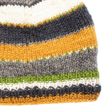 Close-up of a knitted fabric with multicolor stripes on a white background