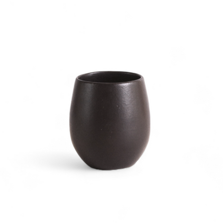 Black ceramic cup on a white background