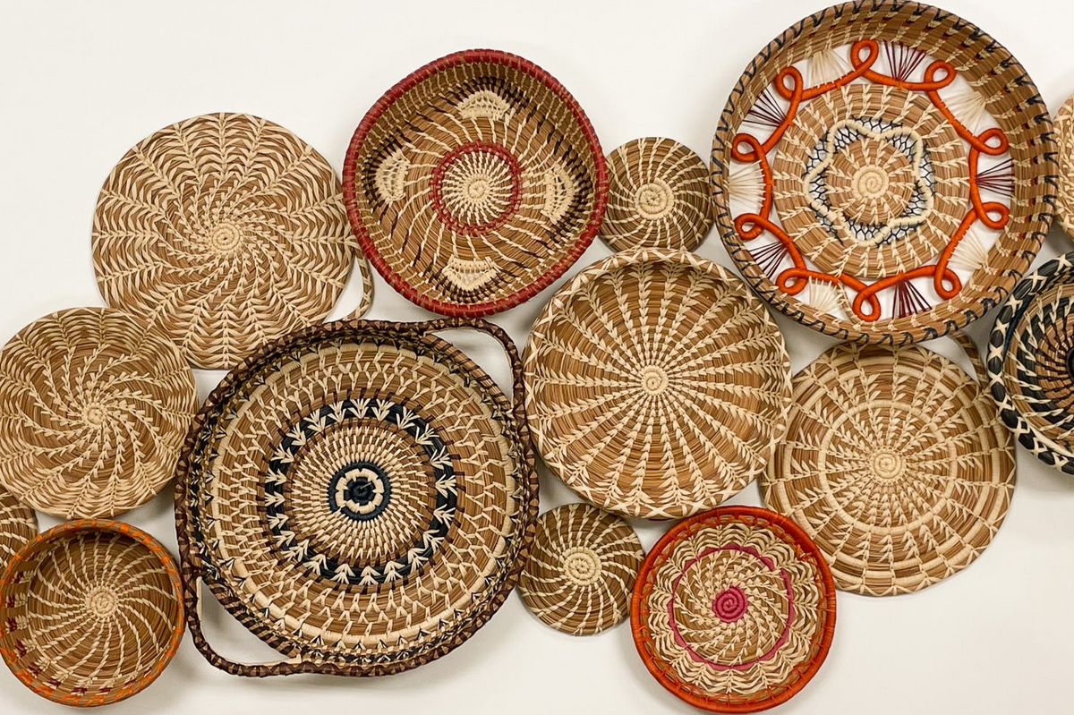 Collection of woven baskets with various patterns on a white background