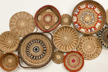 Collection of woven baskets with various patterns on a white background