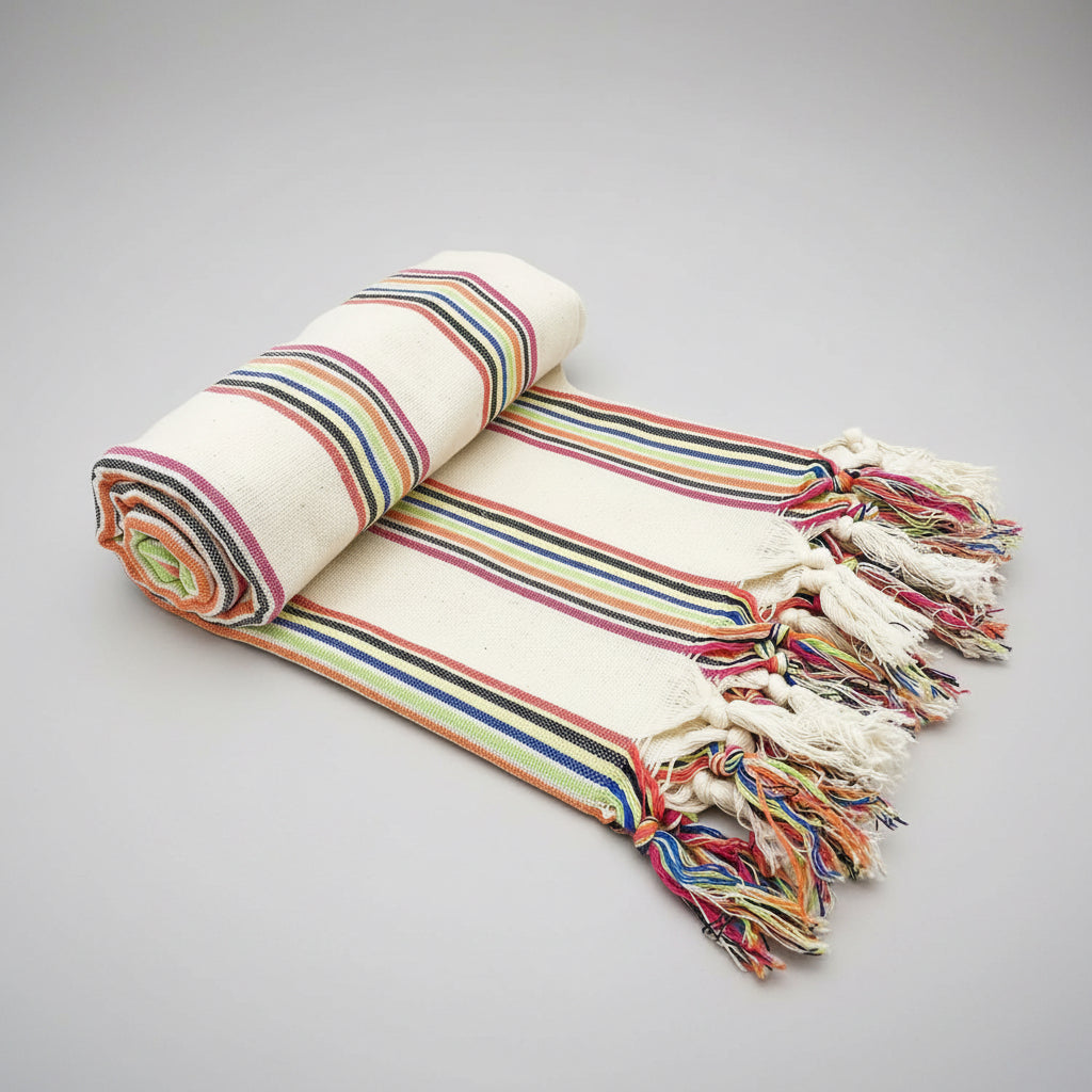 Rolled-up striped towel with colorful stripes on a white background
