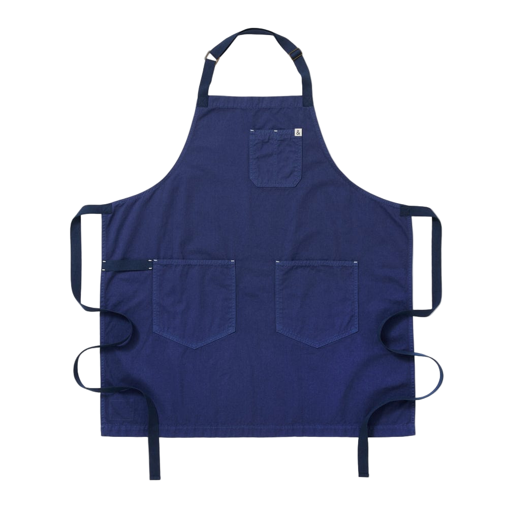 Blue apron with multiple pockets on a white background