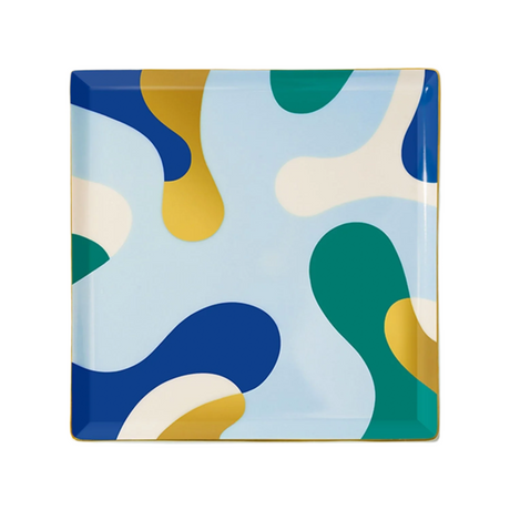 Square plate with abstract colorful design on a light blue background