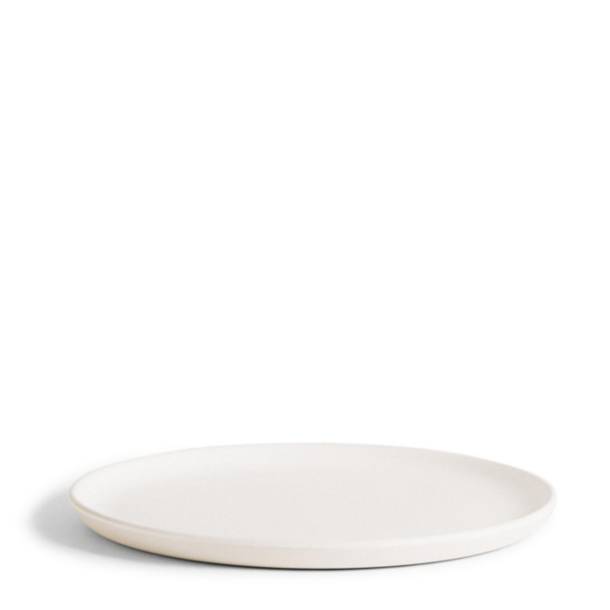 White ceramic plate on a white background
