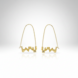 Gold earrings with a white background