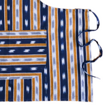 Striped fabric with blue, orange, and white pattern on a white background