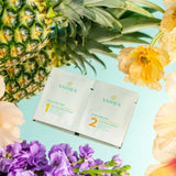 Vaihea skincare product packaging with a pineapple and flowers on a light blue background
