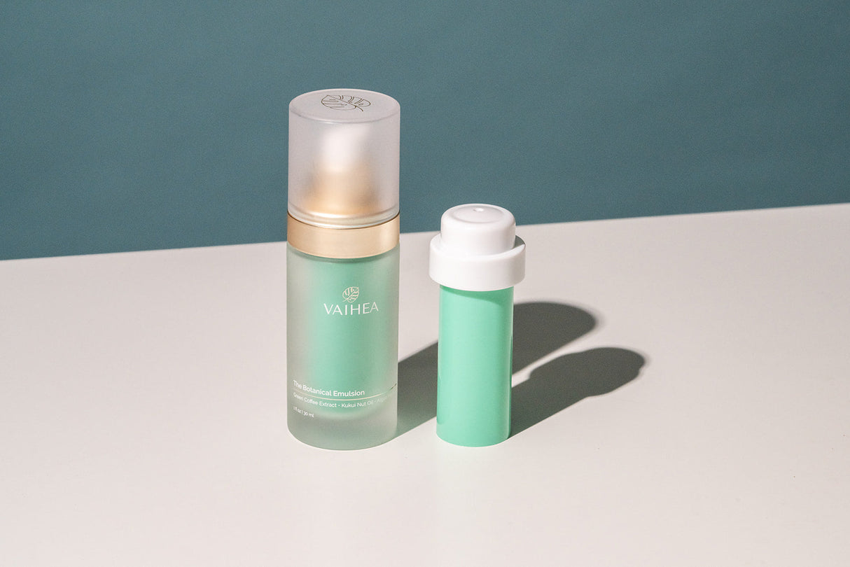 Two skincare products, a serum and a refill tube, on a light surface with a teal background.