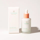 Vaihea skincare product with dropper bottle and box on a light background