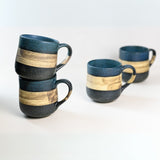 Two stacked and two single handcrafted Mino Ware ceramic mugs, each 8 oz, featuring blue and beige stripes, grace a white background, showcasing the elegance of Japanese craftsmanship.