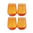 Four amber stemless wine glasses on a white background