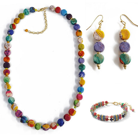 Colorful beaded necklace, earrings, and bracelet set on a white background