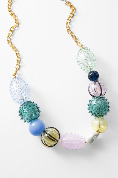 Necklace with multicolored beads on a white background