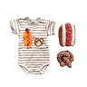 Striped baby onesie with hot dog and pretzel design, accompanied by a matching headband and booties on a white background.