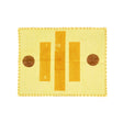 Yellow fabric placemat with brown circular patterns on a white background