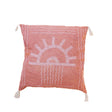 Decorative pillow with sun design on a white background