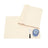 Beige placemats with a spoon and blue glass on a white background