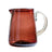 Amber glass pitcher on a white background