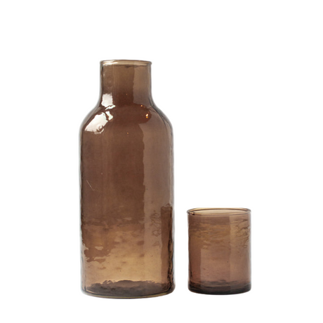 Two brown glass bottles on a white background