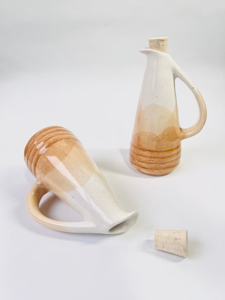 Two ceramic vessels with a gradient finish on a white background