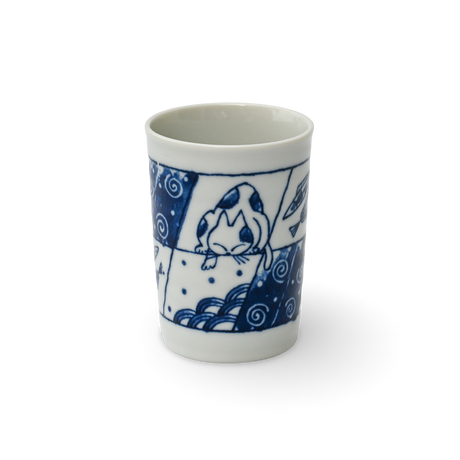 This exquisite blue and white ceramic cup, the Adorable Cat 1 Tea Cup, is a fine example of Mino-ware, showcasing a charming cat design set against a striking black background.