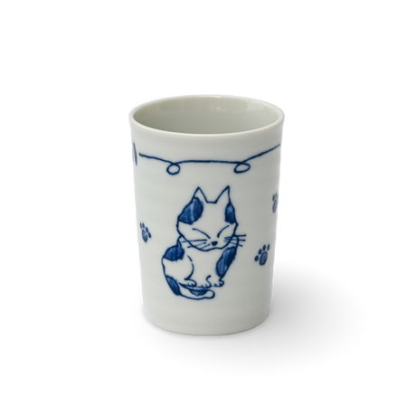 The Adorable Cat 3 Tea Cup is a white Mino-ware ceramic cup featuring blue cat illustrations and paw prints on a black background, reminiscent of Gifu Prefecture's traditional style. It holds 180ml (6oz.).