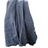 Blue textured blanket draped over a white stool in a home setting