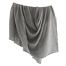 Gray throw blanket draped over a white background