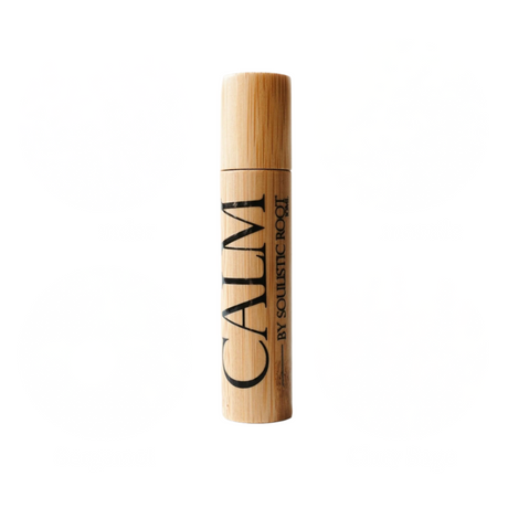 Wooden roller bottle labeled 'CALM' on a white background
