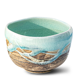 A Japanese Matcha Tea Bowl featuring a blue interior and brown glaze exterior, crafted using traditional Minoyaki pottery techniques.