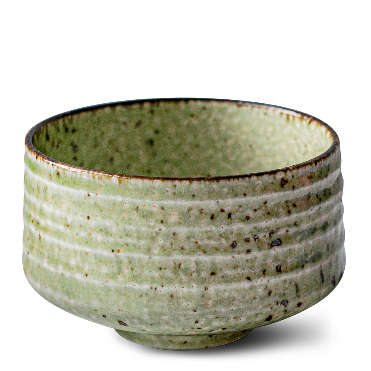 This Kaneni White Ceramic Matcha Bowl, reminiscent of Japanese pottery, features a green textured surface and a slightly darker rim—perfect as a matcha accessory to complement your set.