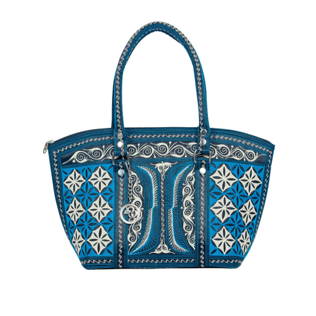 Blue handbag with decorative patterns and a large letter 'B' on a white background