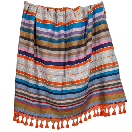 Colorful striped skirt with tassels on a white background