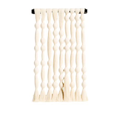 Decorative wall hanging with a textured pattern on a white background