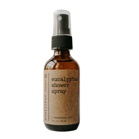 Brown glass bottle with a spray top labeled 'eucalyptus shower spray' on a white background