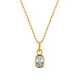 Gold necklace with a clear gemstone pendant on a white background