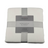 Folded Newcastle blanket with a label on a white background