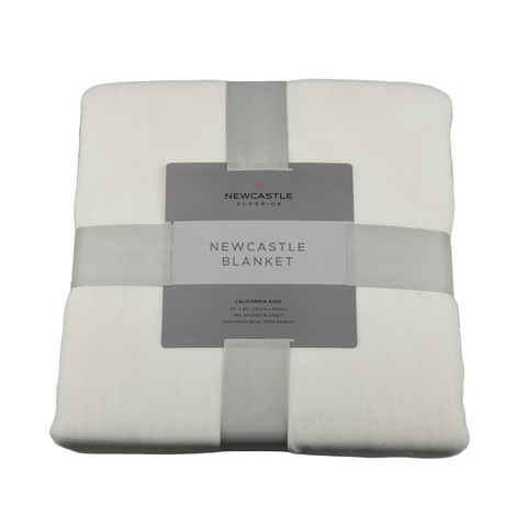 Folded Newcastle blanket with a label on a white background