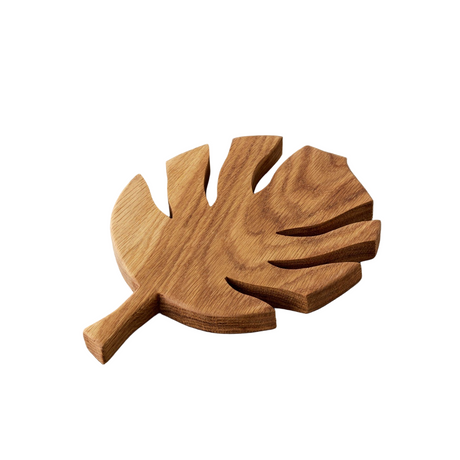 Wooden leaf-shaped trivet on a white background
