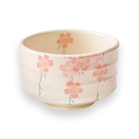 The Pink Sakura Flowers Ceramic Matcha Bowl showcases a pink cherry blossom design on a black background, crafted with traditional Minoyaki pottery techniques.
